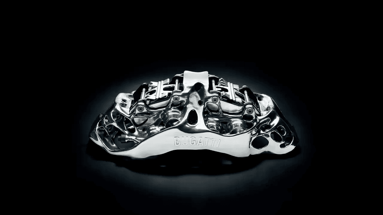 La pinza freno monoblocco a otto pistoni di Bugatti è il più grande componente funzionale al mondo in titanio prodotto mediante stampa 3D. (fonte: Bugatti)