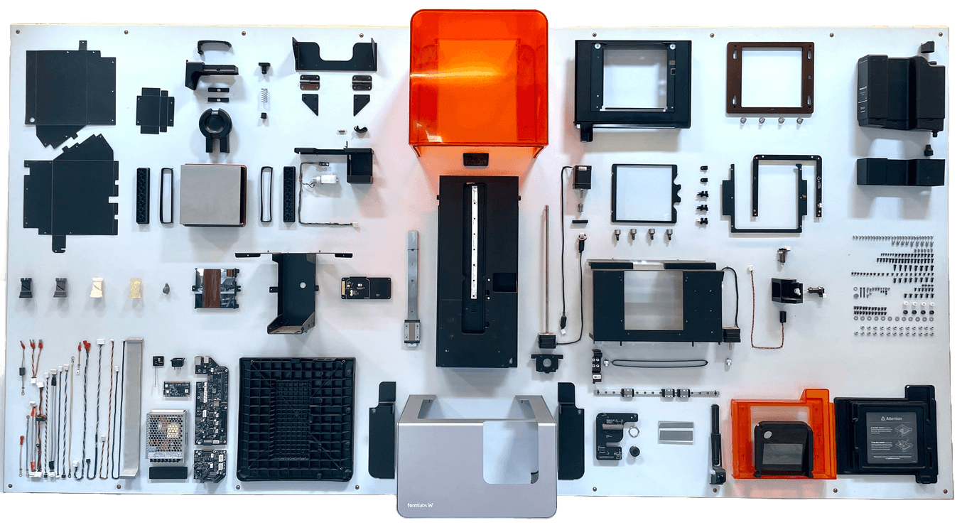 A photograph of a deconstructed Form 2 3D printer
