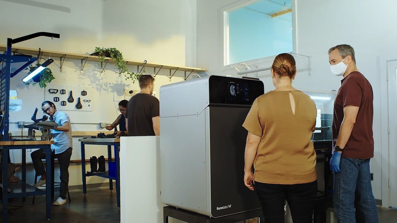 The Fuse 1 3D printer and Fuse Sift 3D print post-processing machine in a studio setting.