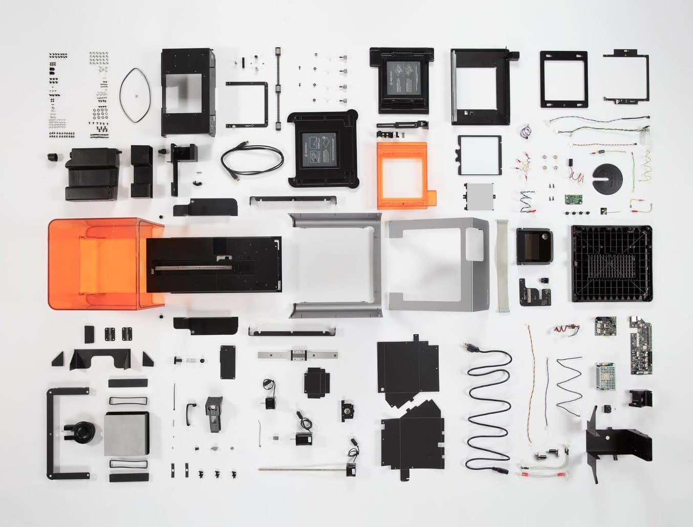 Parts and components of the Form 2 stereolithography 3D printer. Read Bunnie Huang’s in-depth teardown.