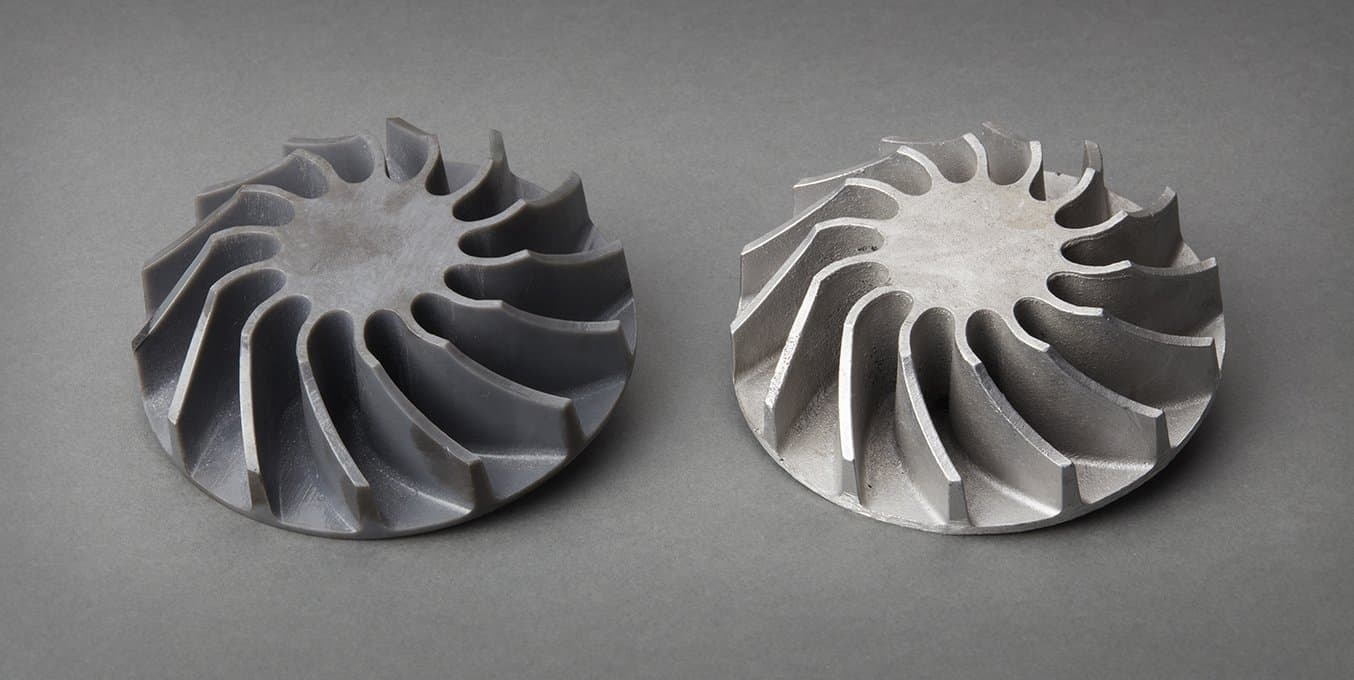 A 3d printed pattern next to a final metal part.