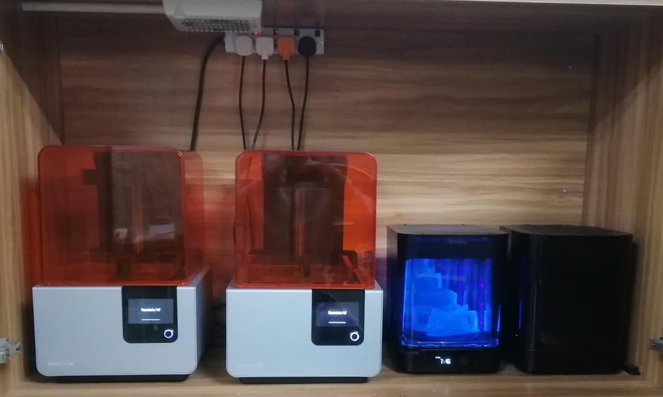 form 2 printers on a shelf