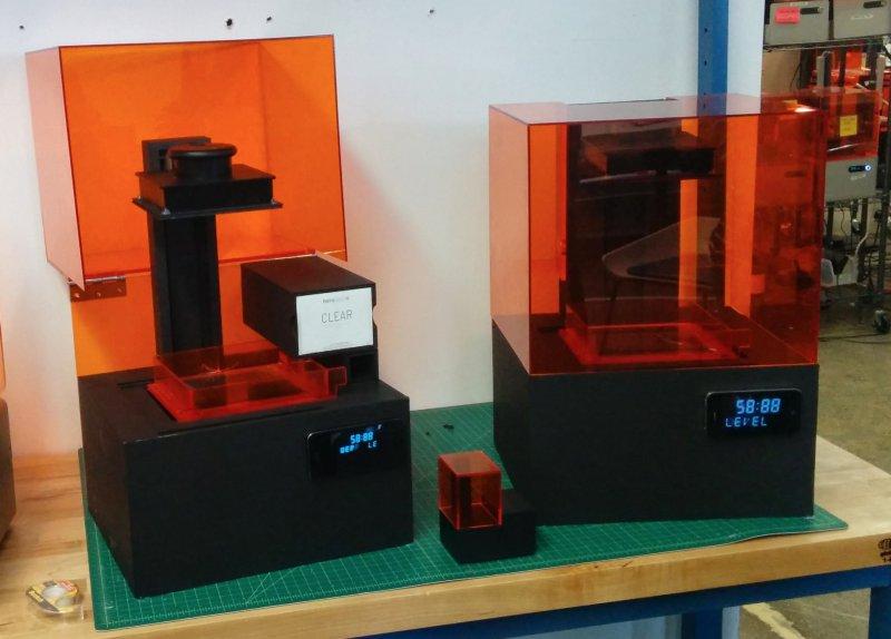 Looks-like prototypes of the Form 2 SLA 3D printer with different solutions for cartridge placement.