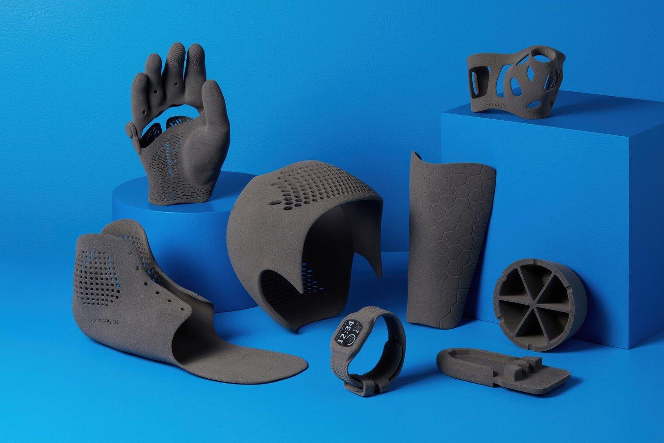 Photo of eight different flexible, SLS 3D printed medical parts