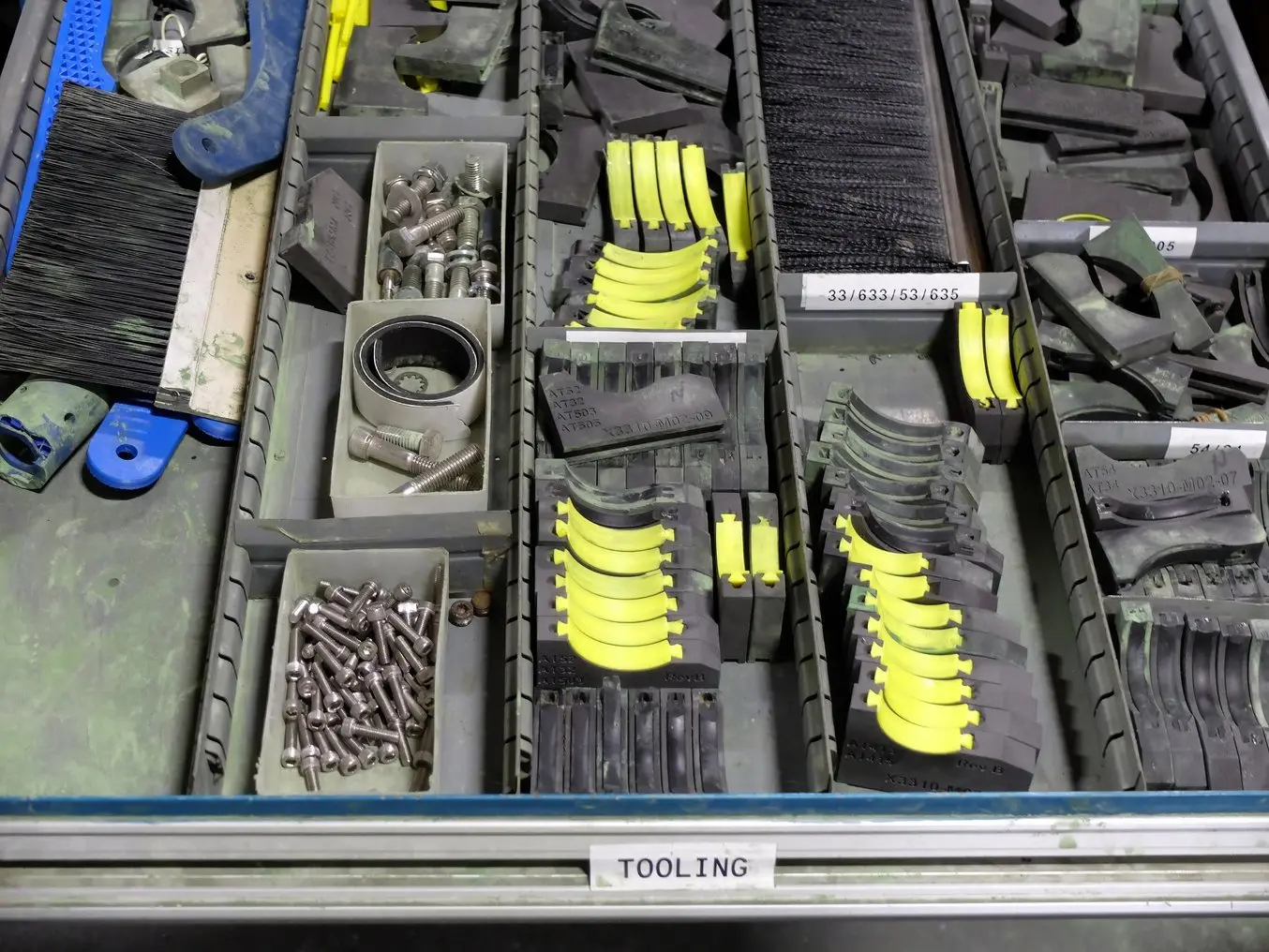 drawer full of 3d printed parts for eaton manufacturing aids