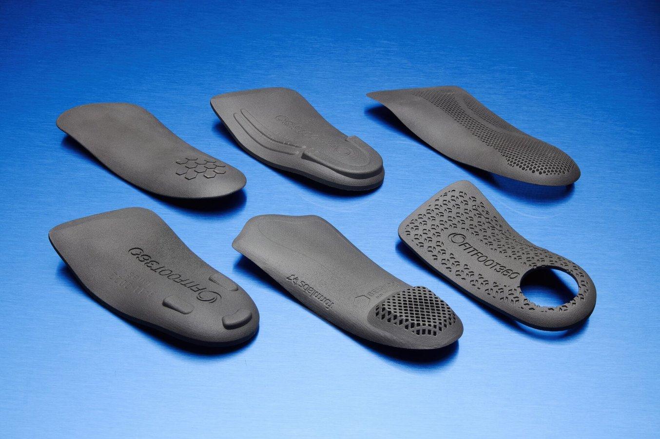 3D Printed insoles on a Blue Background