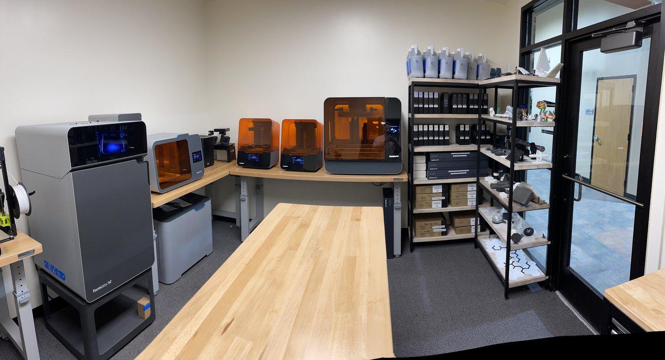 The 3D printing room at Next Meters manufacturing facility hosts a Fuse 1, Form 3, and Form 3L.