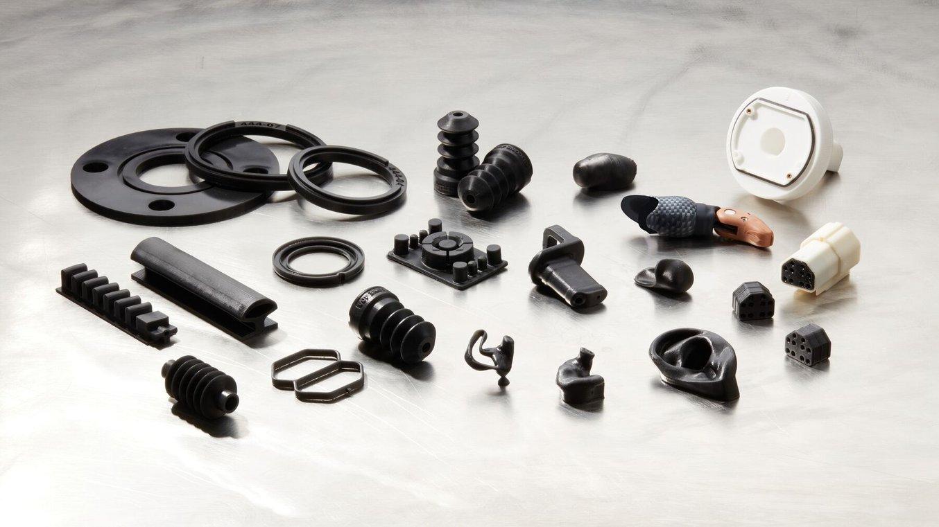 A selection of black silicone medical devices and components