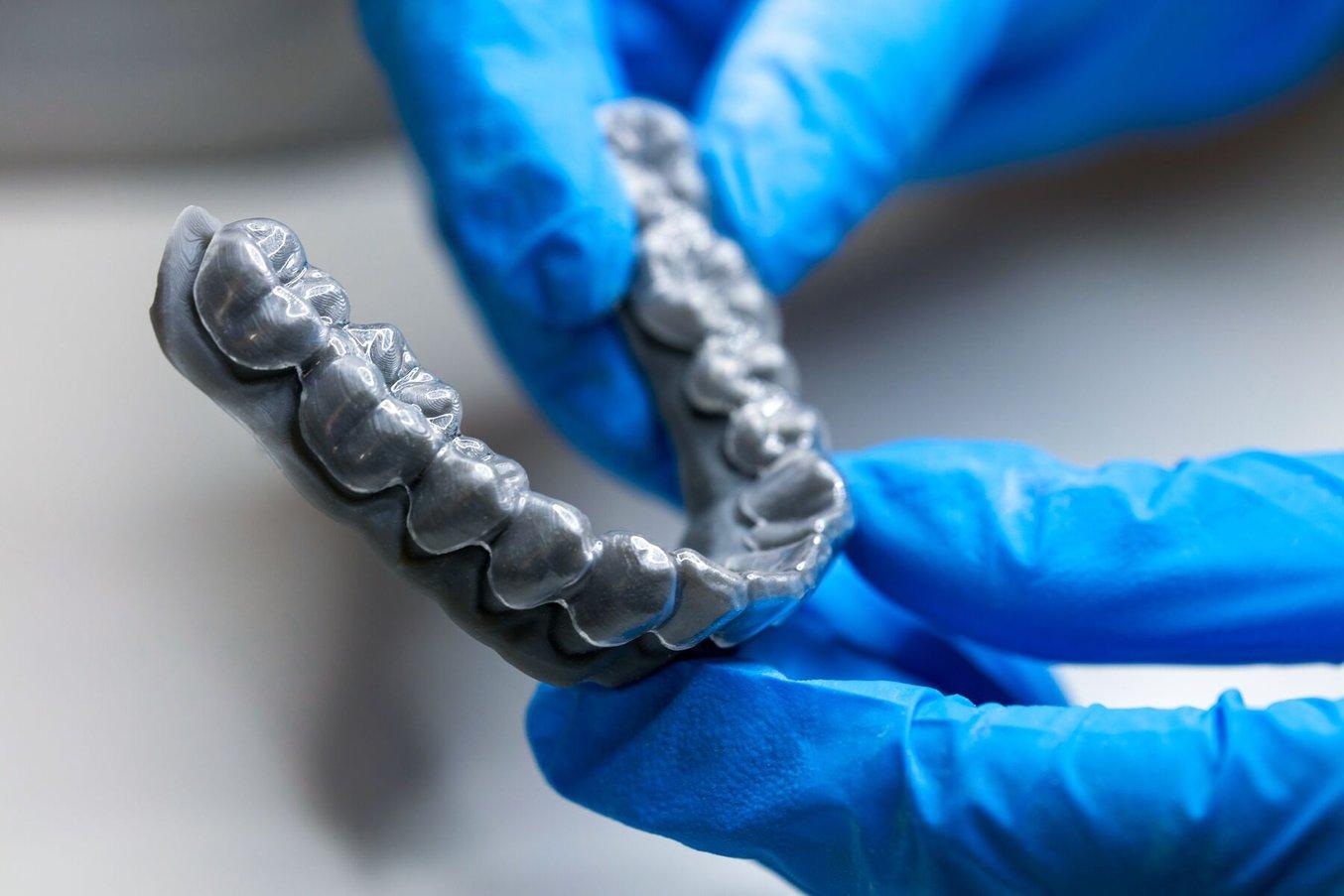Vacuum forming and pressure forming over 3D printed models are the go-to methods for producing clear aligners in orthodontics.
