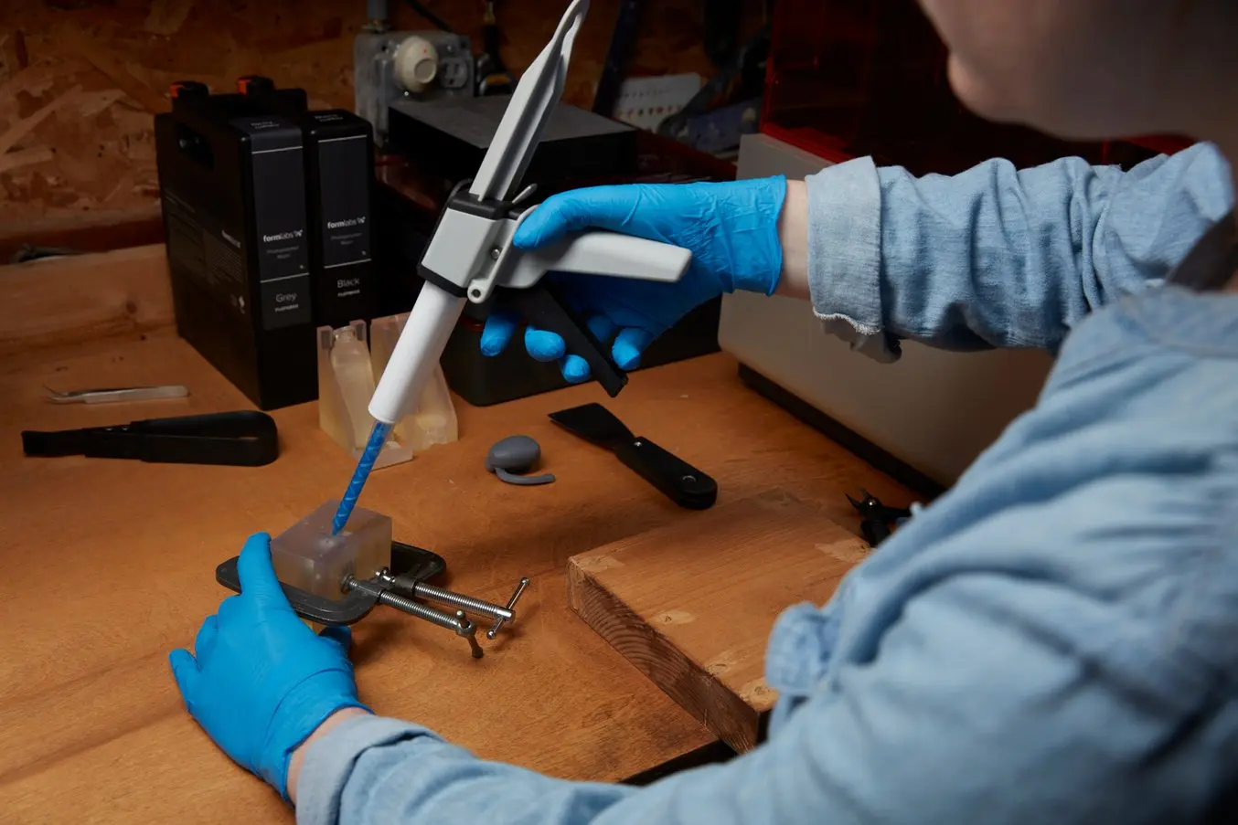Person injecting silicone into a mold