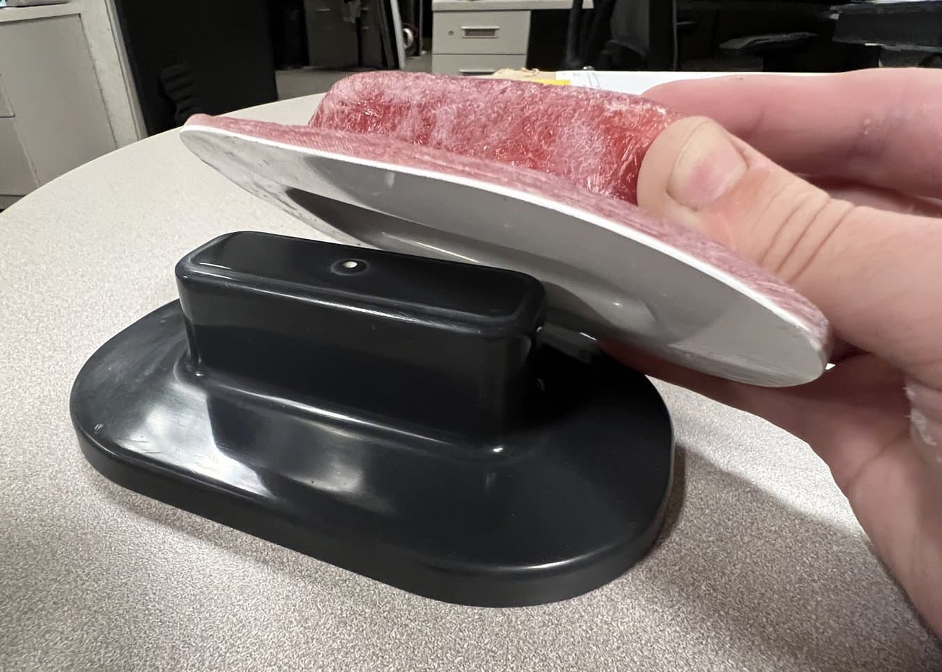 A fiberglass part being taken off of a 3D printed mold.