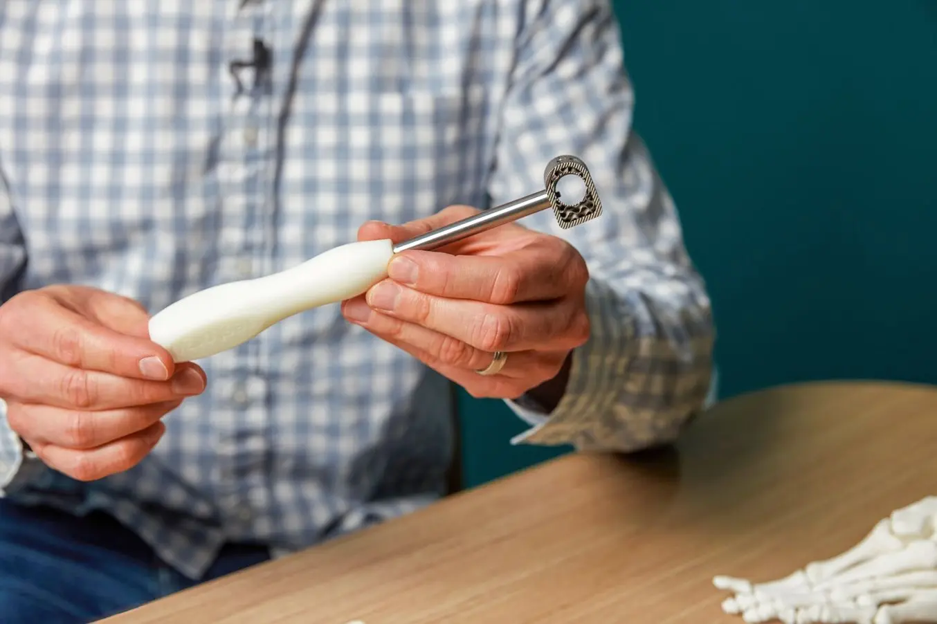 a man holds a 3d printed anatomical part