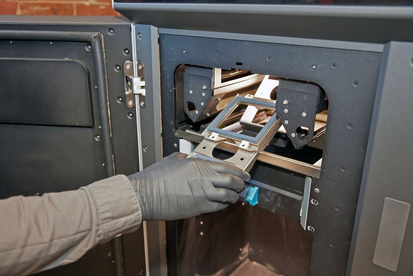 The optical cassette of the Fuse 1 SLS 3D printer being removed.