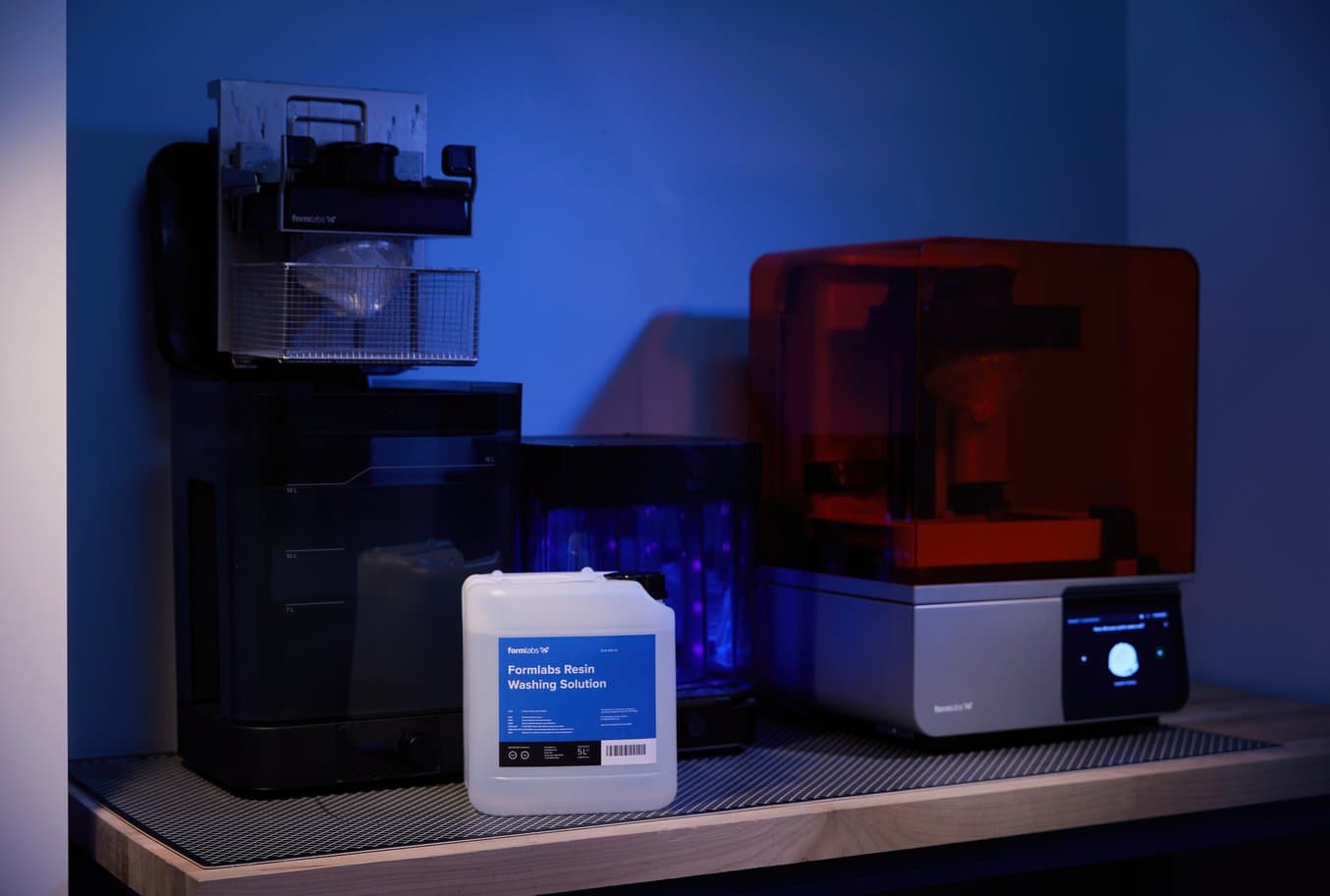 Form Wash, Form Cure, and Form 4 3D printer plus Resin Washing Solution on a worktop