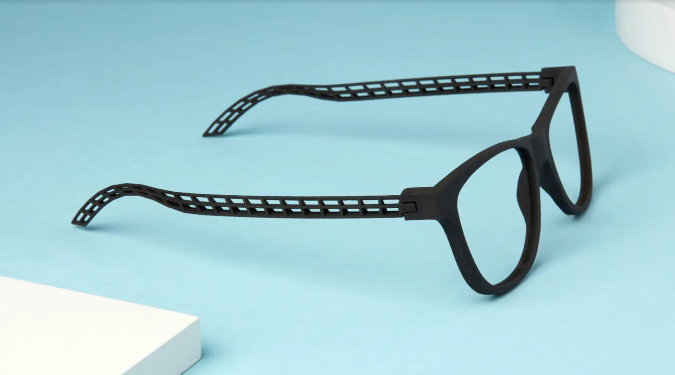 black sls 3d printed eyewear frames on a light blue background