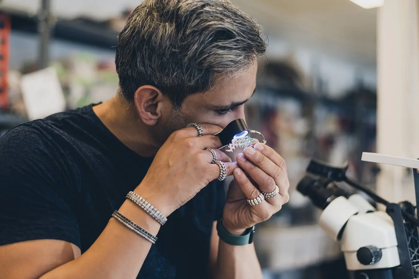 Riaz examines a ring prototyped on the Form 3 stereolithography 3D printer.