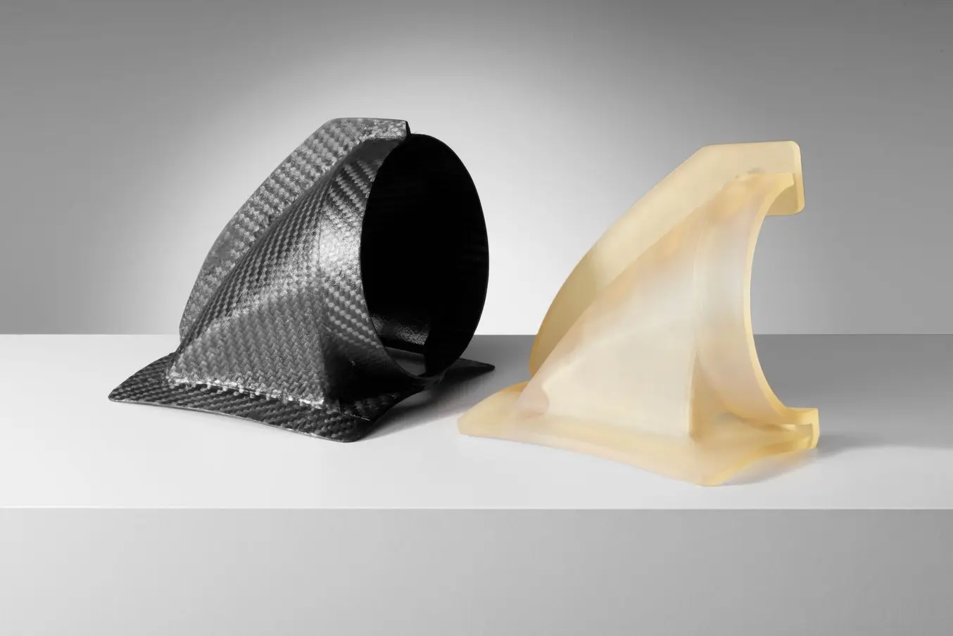 a carbon fiber automotive part and a High Temp Resin 3D printed carbon fiber mold