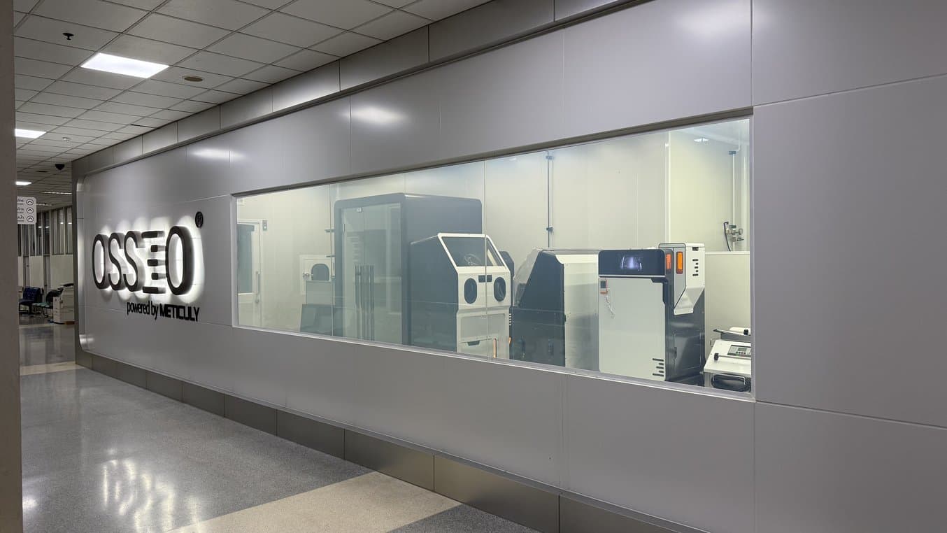 sls 3d printers in a room