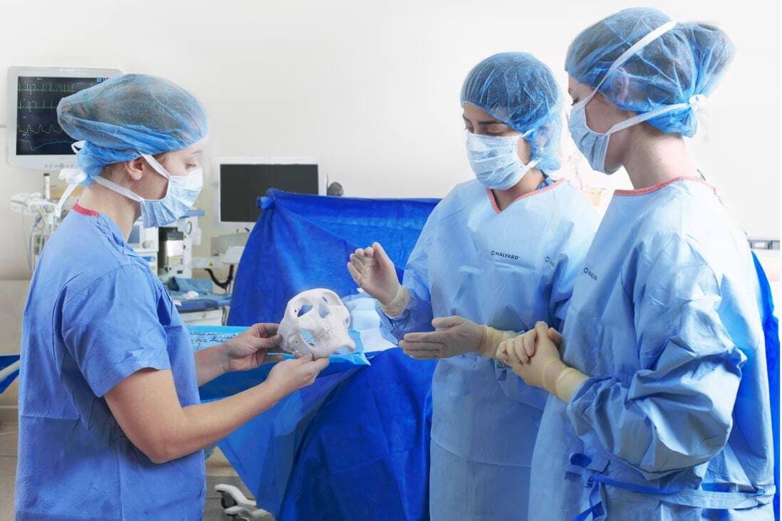 medical workers with 3D printed sample